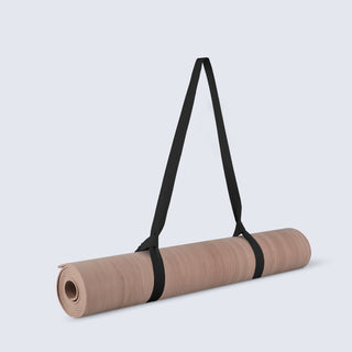 Rolled-up TRNR Hero Mat in Clay Marble Colour and 4 mm Thickness | Featuring Black Carry Strap