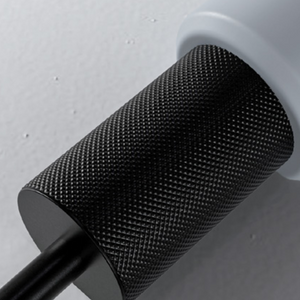 Close-Up Shot of the TRNR Power Grip Pro 100 LB in grey with knurled design