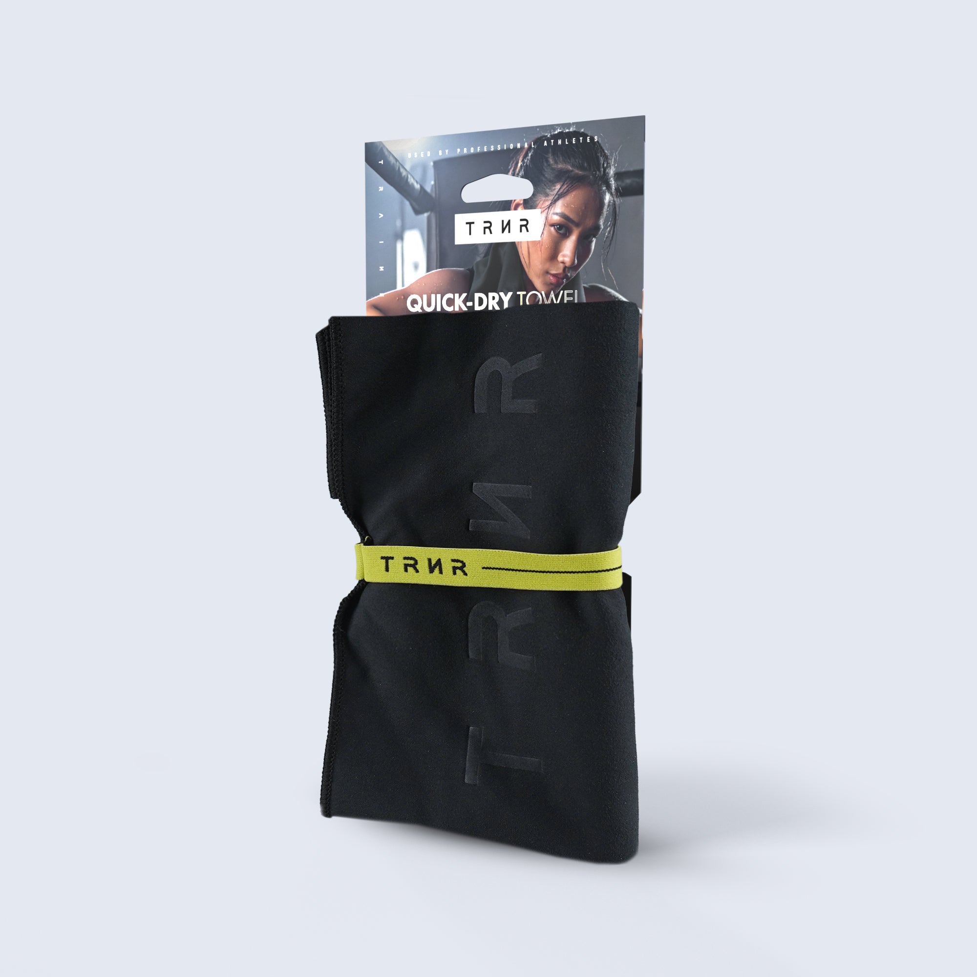 TRNR  Quick-Dry Towel in Black and Lime with its packaging