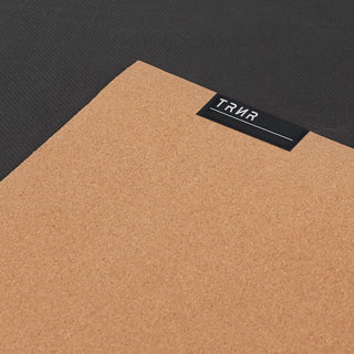 Close-up on Both Sides of the TRNR Cork Mat Featuring Cork Top and Natural Tree Rubber Base