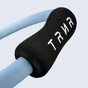 Close-up on the Ergonomic Grip of the TRNR Pilates Ring in Celestial Blue