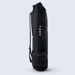 TRNR Studio Carry Sack in Black Featuring Drawstring Closure, Shoulder Strap, and Small Zipper Pocket