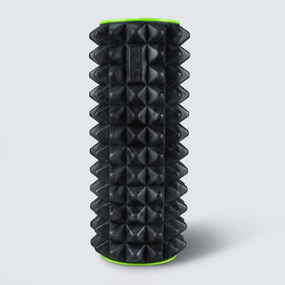 TRNR Black textured foam roller with green accents on a light gray background